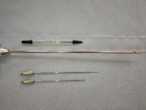 Comparing cannula sizes. A regular biro next to a traditional liposuction cannula next to microlipo cannuals.